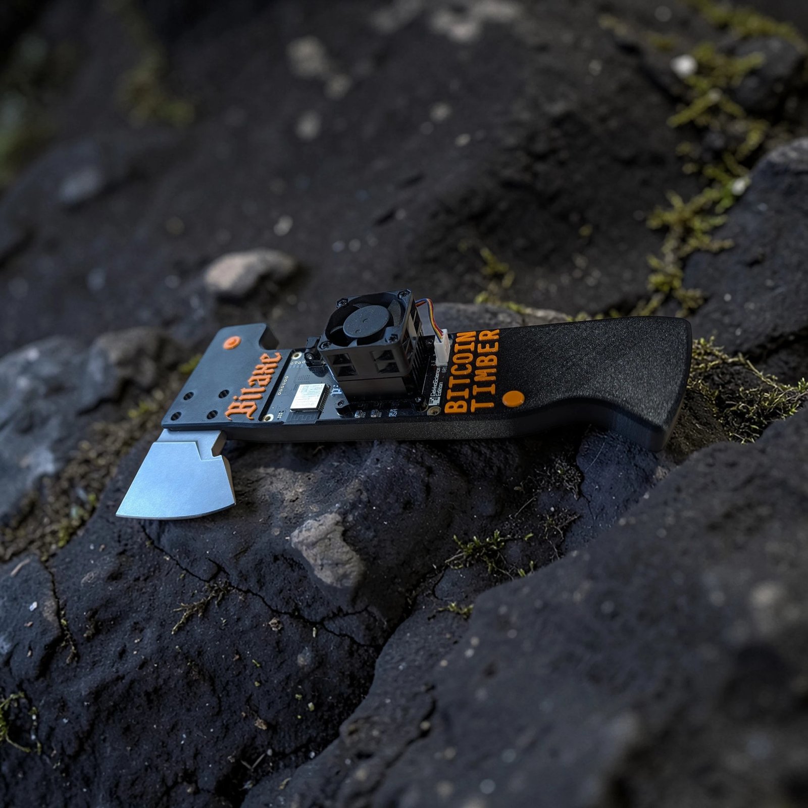 The TimberAxe printed prototype on volcanic rock, Bitaxe board and fan installed